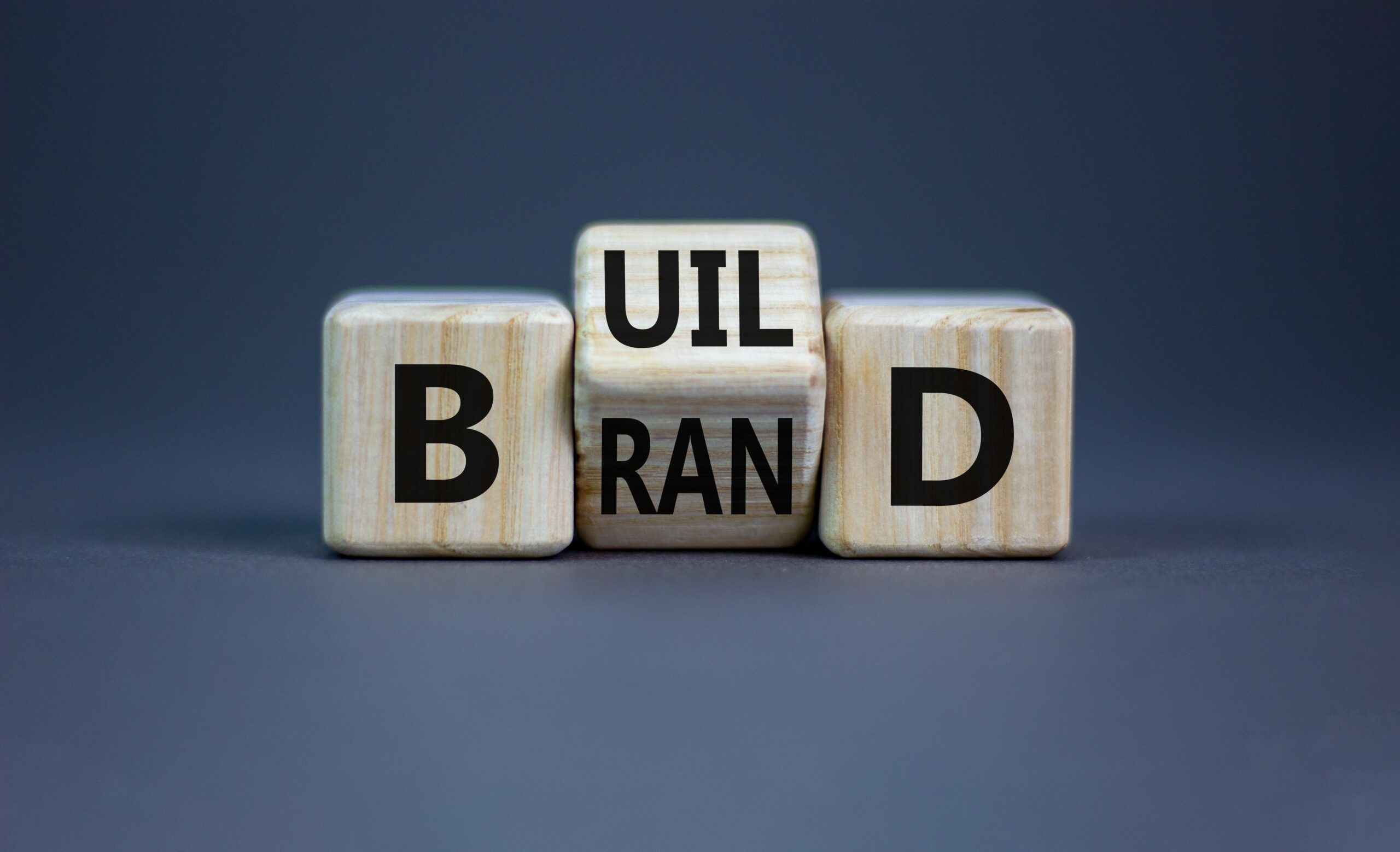 Die with aligned brand and build text